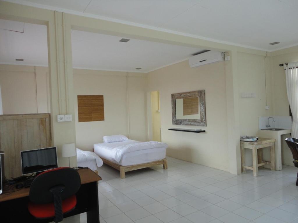 Urbanview Hotel Wayan Mansion Denpasa Kamer foto